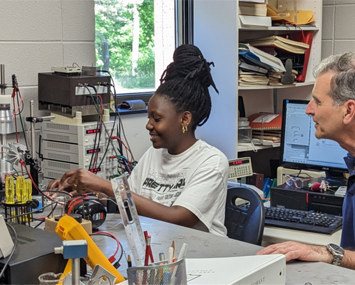 student works on a physics research project for experiential learning