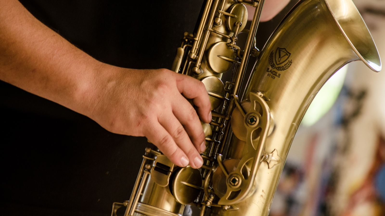 a closeup view of someone playing a saxophone