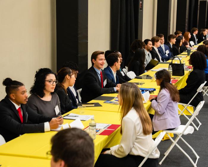 speed networking students at tables