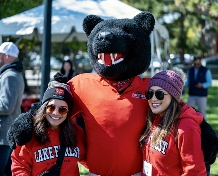 Boomer mascot and two Lake Forest College fans