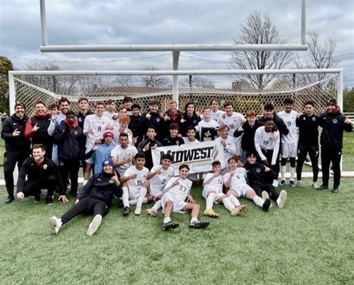 men's soccer team with Midwest Champs sign