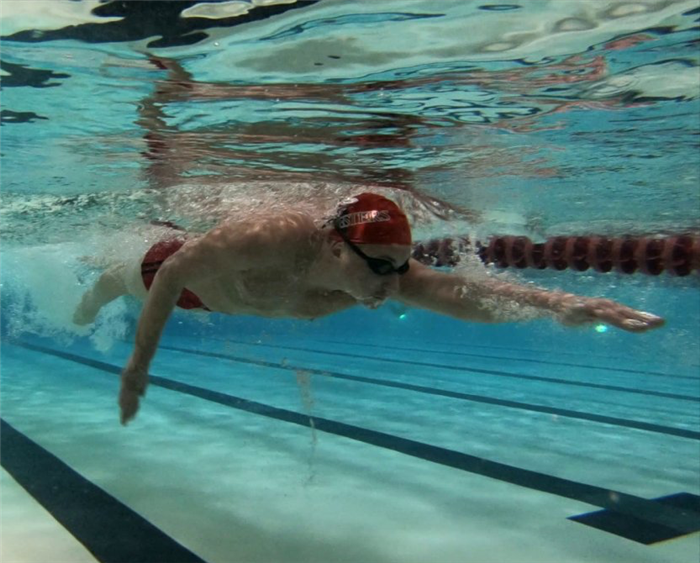 underwater shot of swimmer in pool
