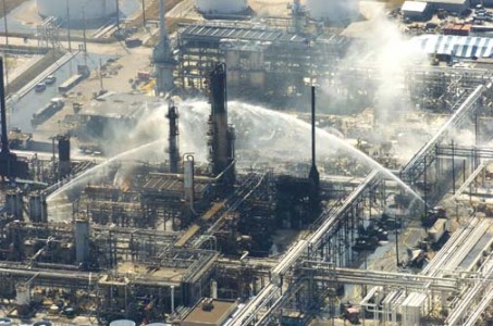 Firefighters battle a blaze and search for victims of an explosion at the BP plant that killed at least 15 people Wednesday, March 23, 2005, in Texas City, Texas. (Photo by Brett Coomer/Chronicle)     HOUCHRON CAPTION (09/17/2005) SECNEWS:  GRIM SCENE:  Fire crews battle a blaze and search for victims of the March 23 explosion that killed 15 people at the BP refinery in Texas City. Federal fines are expected soon in connection with the deadly blast.