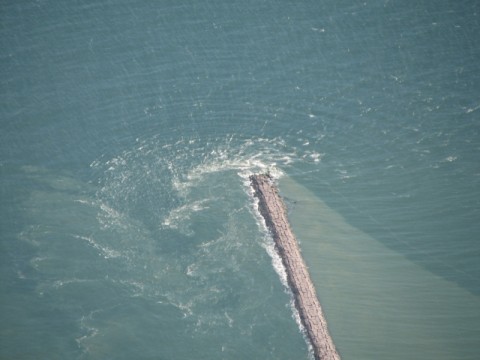 Turbulence along a jetty