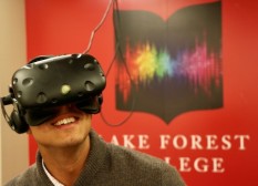 A student explores virtual reality in Lake Forest College's VirtualSpace.